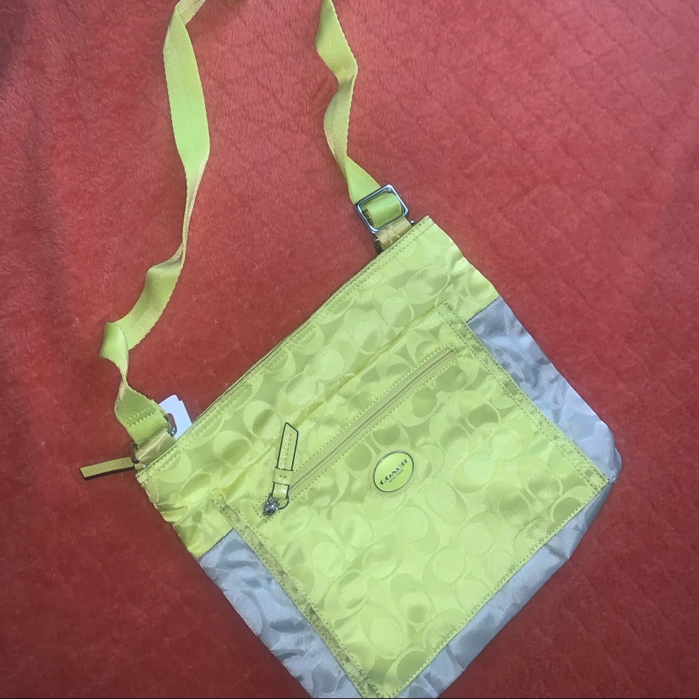 Coach lime cross body zip up yellow 
BRAND NEW
Tags still attached